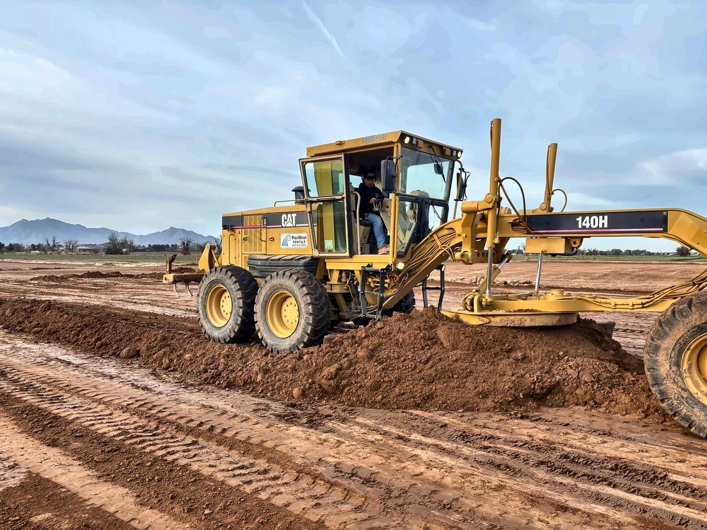 AVE Construction motor grader cutting finish grade
